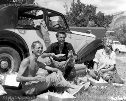 Xan and Daphne Fielding with Dirk Bogarde on the set of Ill Met by Moonlight